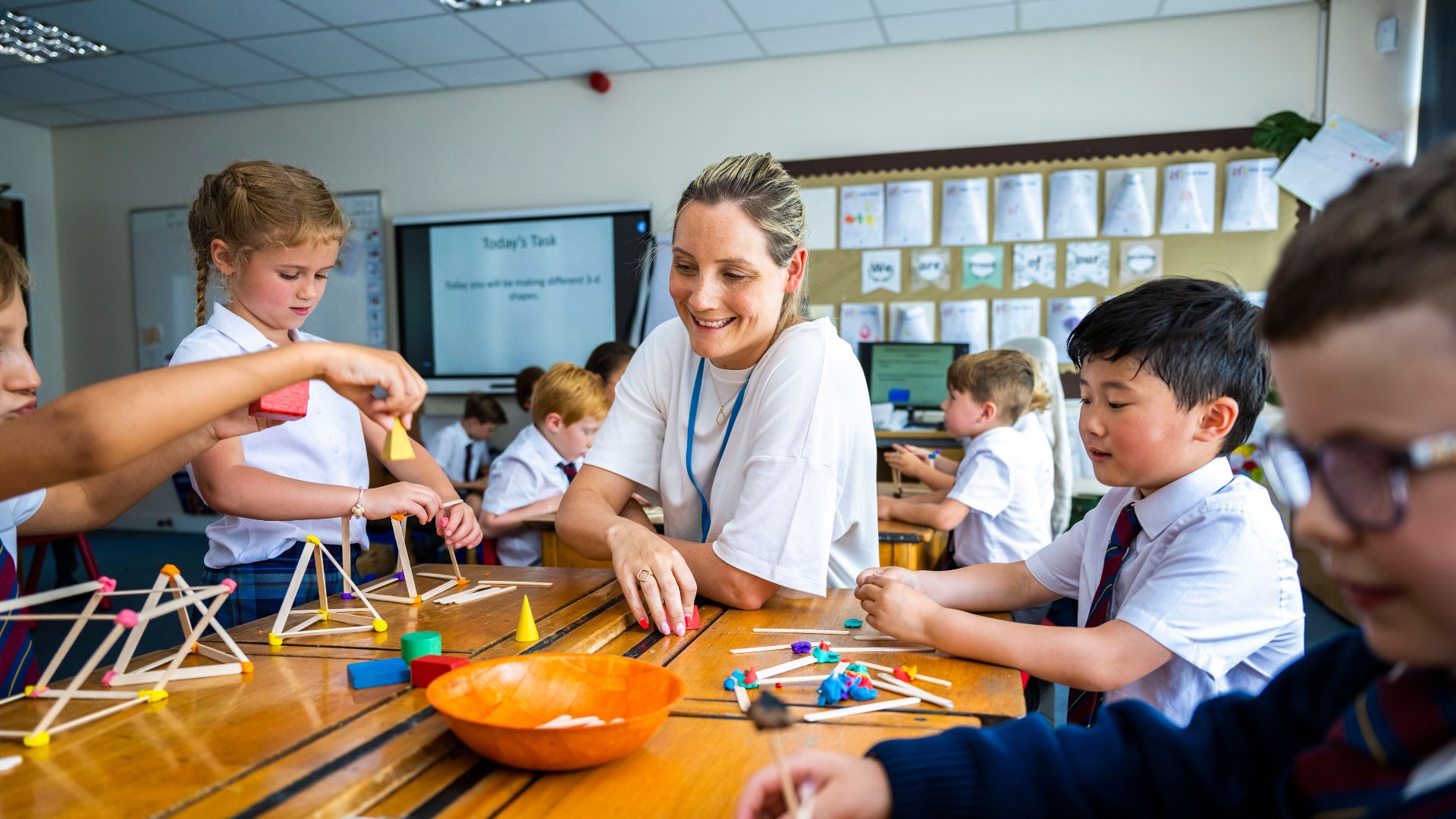 photo of teacher and pupils in class